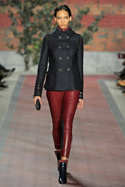 model from tommy hilfiger's fall 2012 runway show wearing oxblood leather pants and navy pea coat