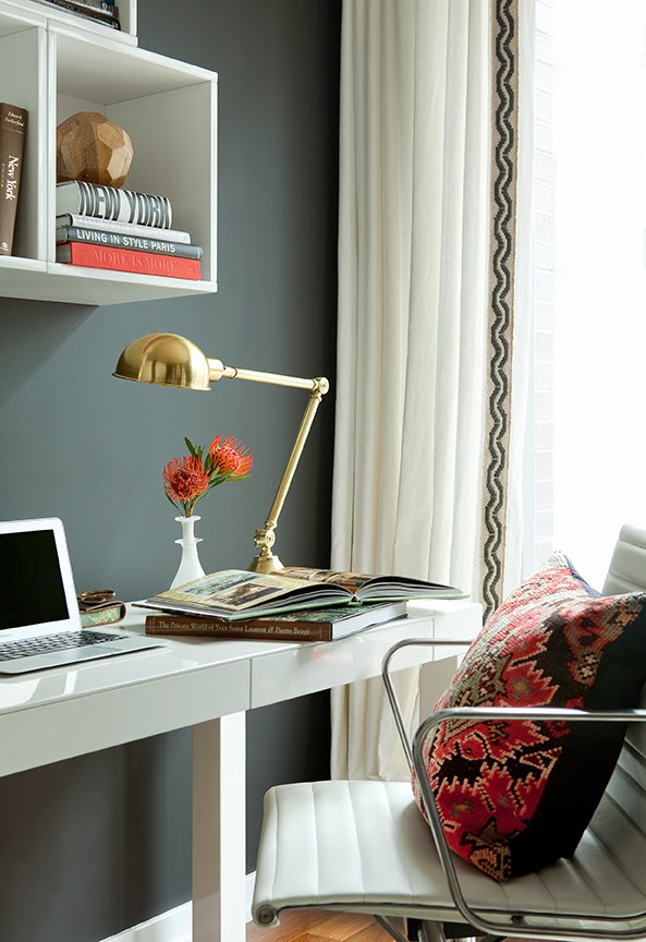 Home office by Jenny Wolf with grey walls, wallpapered ceiling, a white desk and white office chair