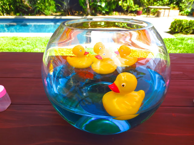Rubber duckies in a fish bowl creative centerpiece baby shower