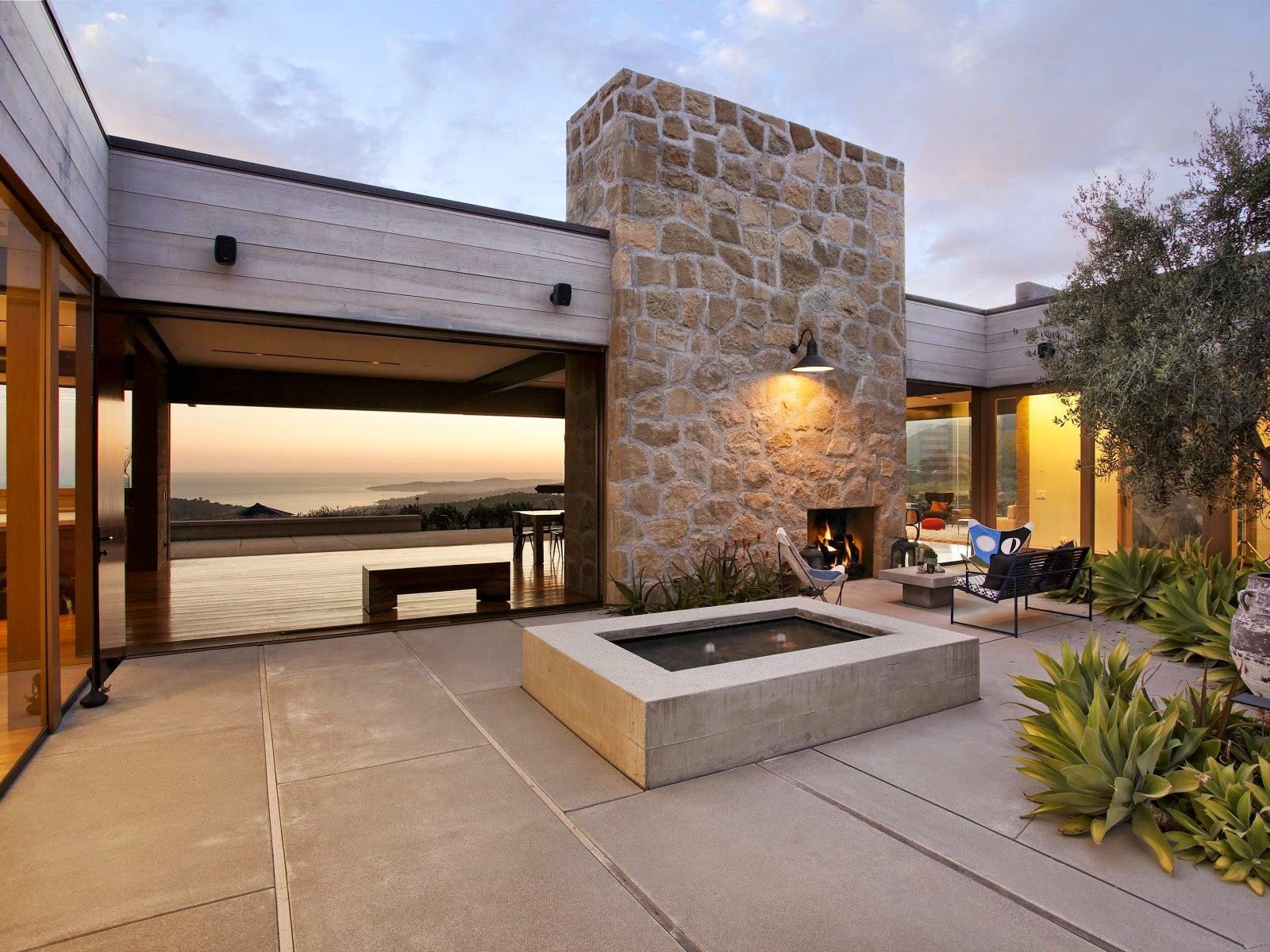 Backyard of a modern home with a fire pit