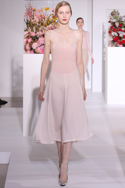 Model wearing a swingy, semi-sheer pale pink dress from Jill Sander's Fall 2012 Ready to Wear runway show