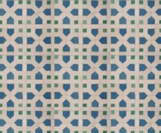 A mosaic tile with a graphic blue, white and green pattern on it 