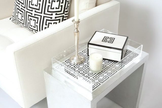 COCOCOZY Lucite Tray holding black and white COCOCOZY Lacquer Box and candle on silver table in a white living room
