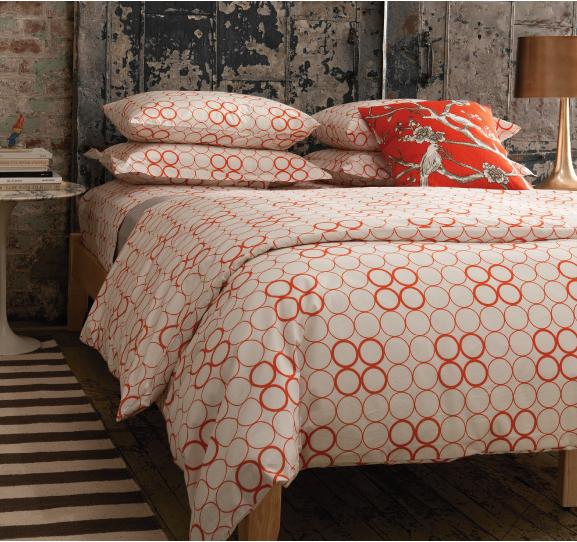 Duvet covered with orange circles of varying thickness arranged in rows by Dwell Studio