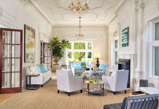 Living room in a historic San Francisco mansion with decorative moldings & high ceilings