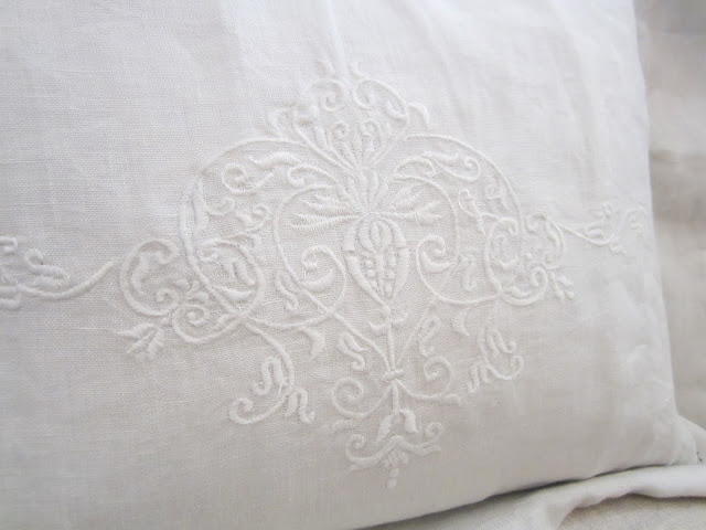 Close up of embroidered details on Pom Pom Interior's bedding