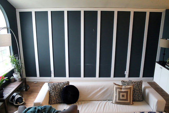Chris Loves Julia living room DIY black paneled walls 