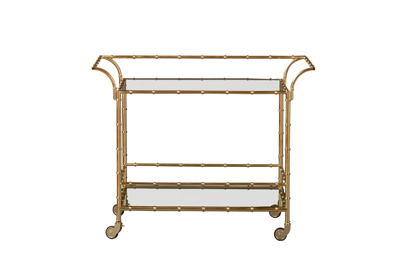 Metal faux bamboo bar cart with glass shelves and a gold finish by Lilly Pulizter