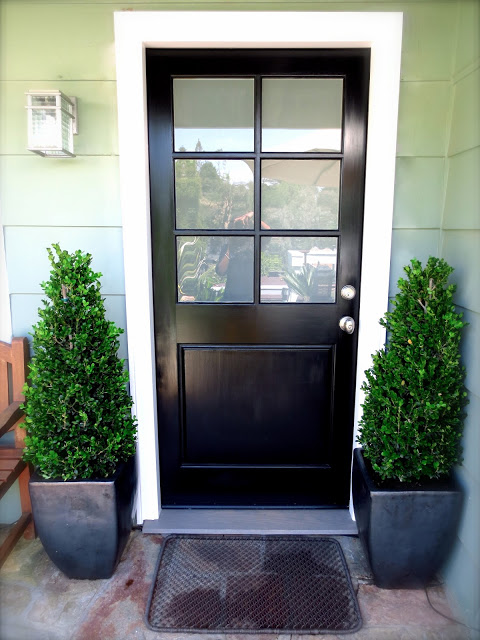 black front door cococozy boxwood topiary topiaries plants modern pots planters wire doormat