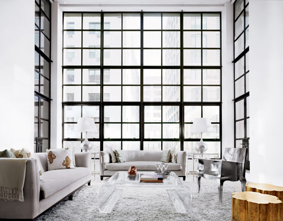 New York City Apartment floor to ceiling windows modern super high ceiling shag rug grey sofa