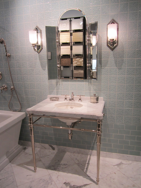 Bathroom with Michael S. Smith's Labyrinth tiles for Ann Sacks from floor to ceiling, an undermount sink where you can see the pipes and a marble tile floor