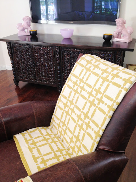  COCOCOZY Plaid Solid Throw in gold on Paula B.'s brown leather chair
