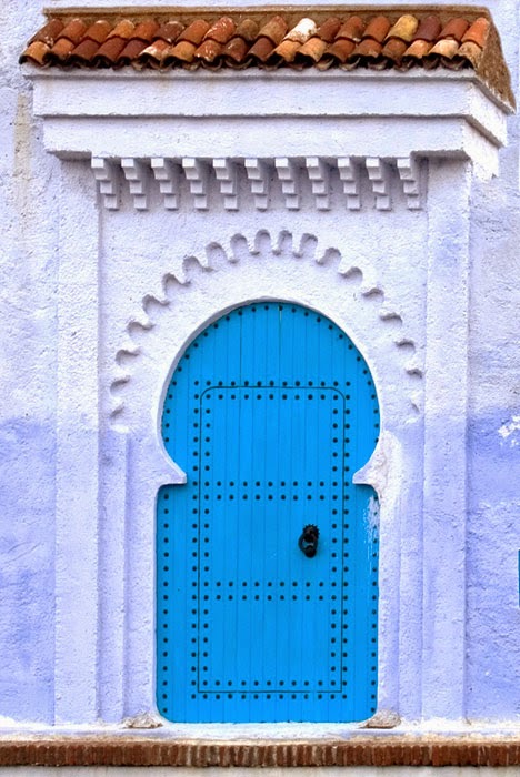 Blue door with nailhead details