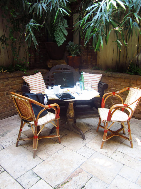 A table in the courtyard in action