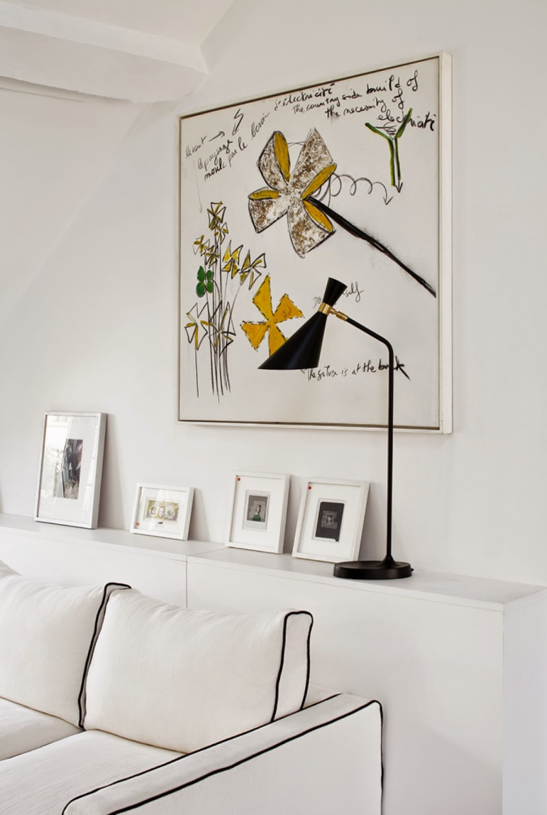 White Paris apartment with black and yellow accents