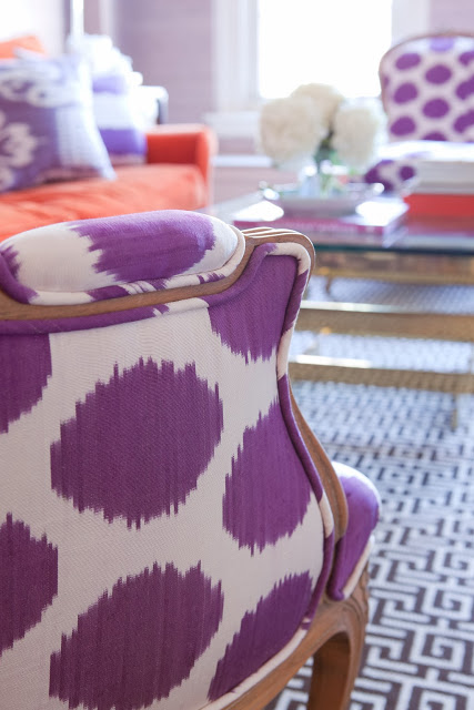 Close up of a purple and white armchair in a lavender living room
