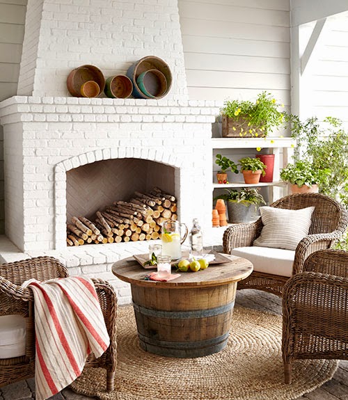 Outdoor living room with wicker chairs and jute rug