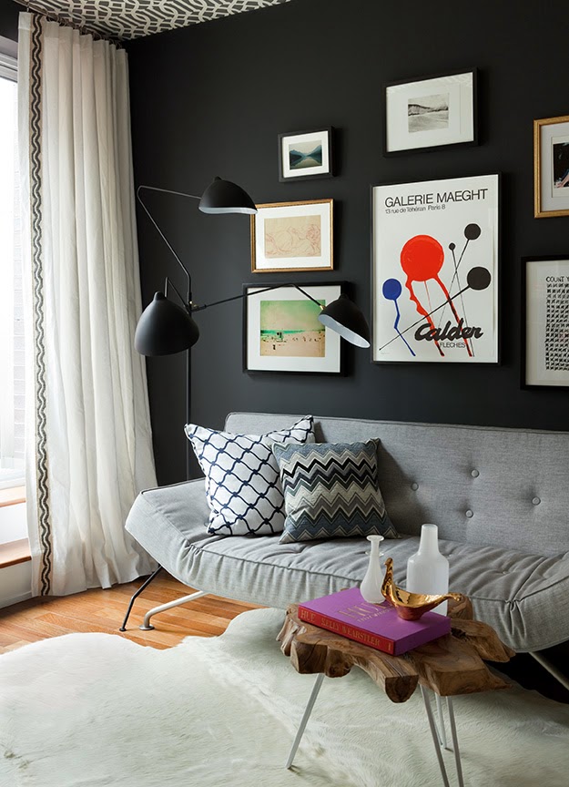 Home office by Jenny Wolf with Charcoal grey walls, wallpapered ceiling, modern furnishings, a gallery wall and a COCOCOZYpillow