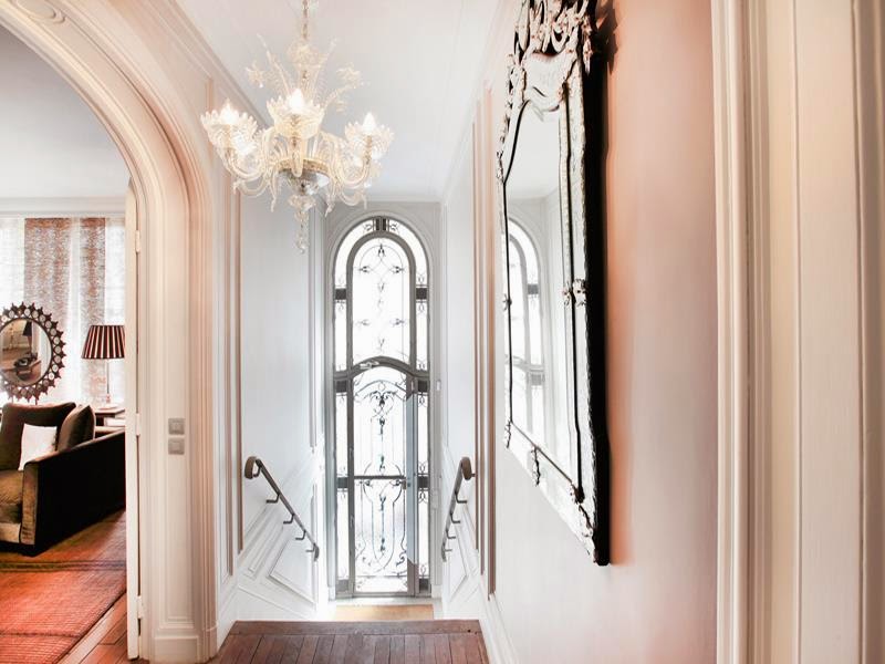 Foyer in a multi million dollar Paris townhouse with glass door