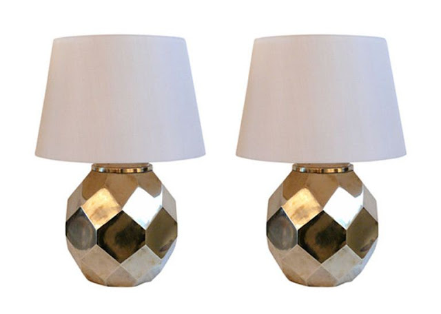 two ceramic lamps with white shades with brass finish