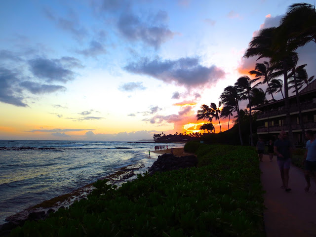Sunset at Poipu beach Kauai Hawaii ocean sea waves palm trees dusk
