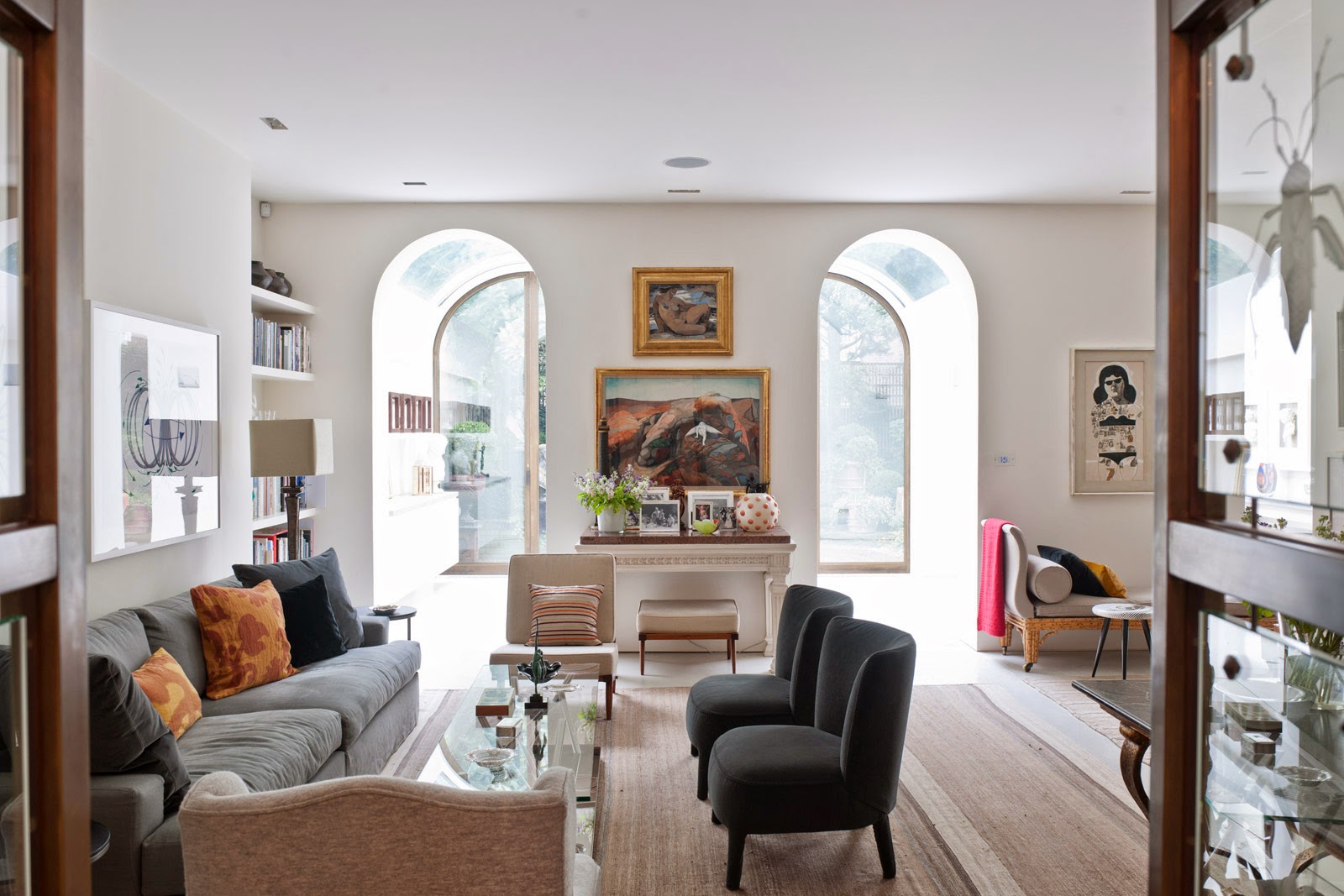 Living room in a London news townhouse Andy Martin Architects with arched entryways