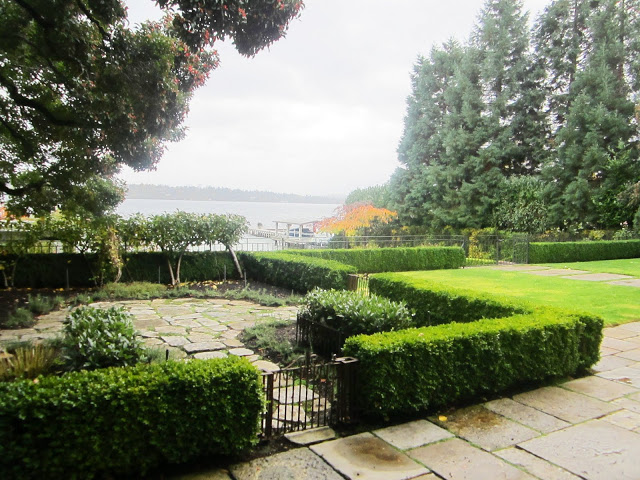 Grounds at a Lake Washington estate with a view of the lake on a cloudy day