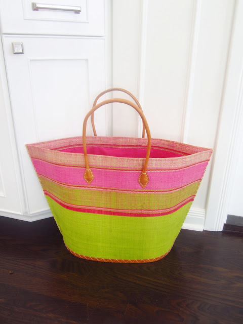 pink and green basket tote bag on kitchen floor