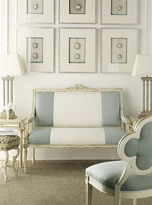 Modern classic living room with upholstered, blue and white striped Louis XIV bench and chair