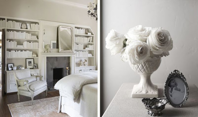 (L) Bedroom with white built in bookshelves, a fireplace with a white moulded mantel, a white armchair, dark wood floor and a large area rug. (L) Close up of white side table holding a white vase holding white roses, a black and white baby photo in an antique silver frame and an antique silver memento