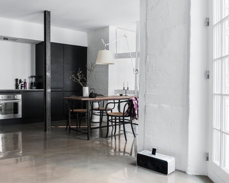 small Copenhagen apartment open floor plan glossy concrete floors