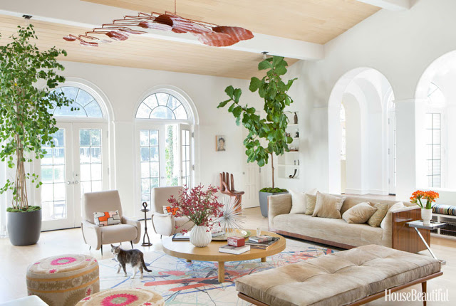 Todd Nickey and Amy Kehoe of Nickey Kehoe's living room in their Malibu home featured in House Beautiful with a large mobile by Stephen Oakes
