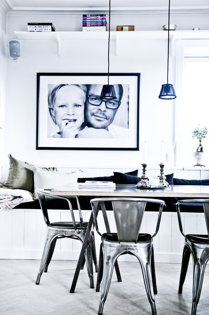 White modern dining room silver cafe chairs blue glass pendant lights light herringbone wood floor