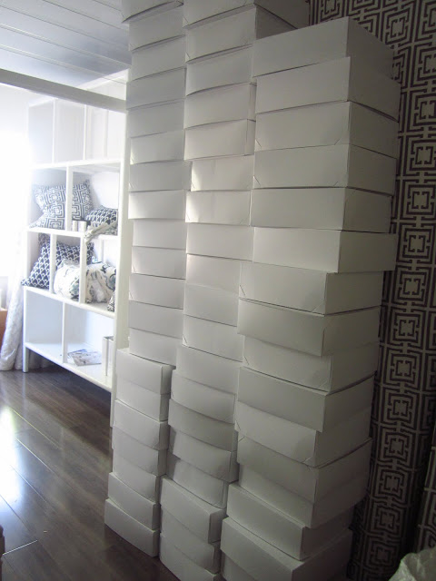Three giant stacks of white boxes at COCOCOZY HQ