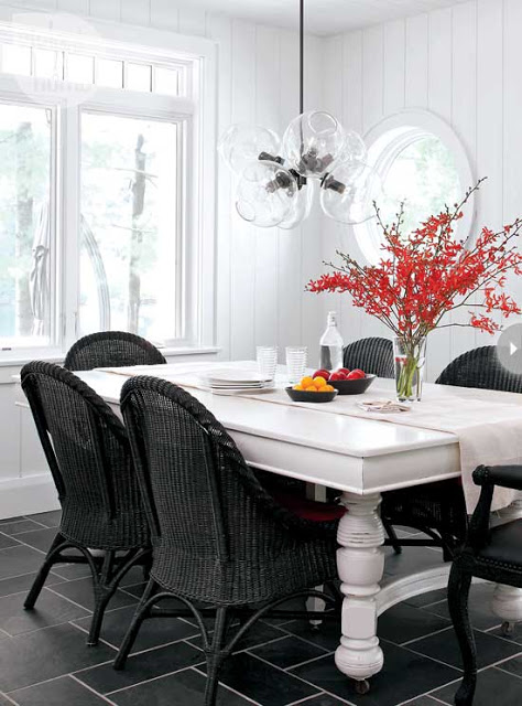 black wicker chairs turned leg wood dining table glass pendant light modern country dining room