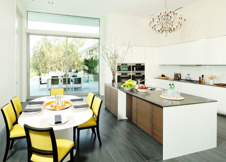 Modern kitchen and dining area with yellow accent chairs