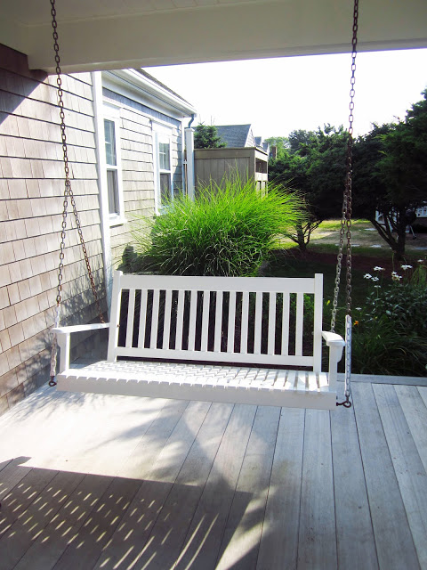 bench porch swing in the front yard