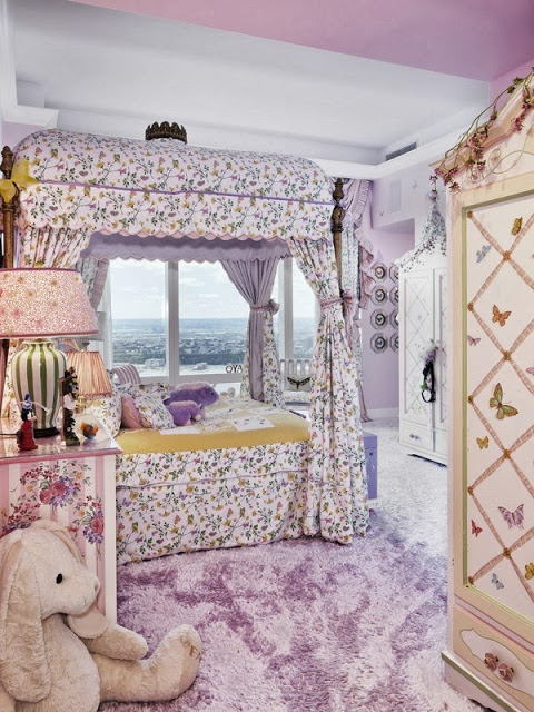 Lavender girls room in a NYC penthouse with a view of the city, lavender carpeting and a canopy bed