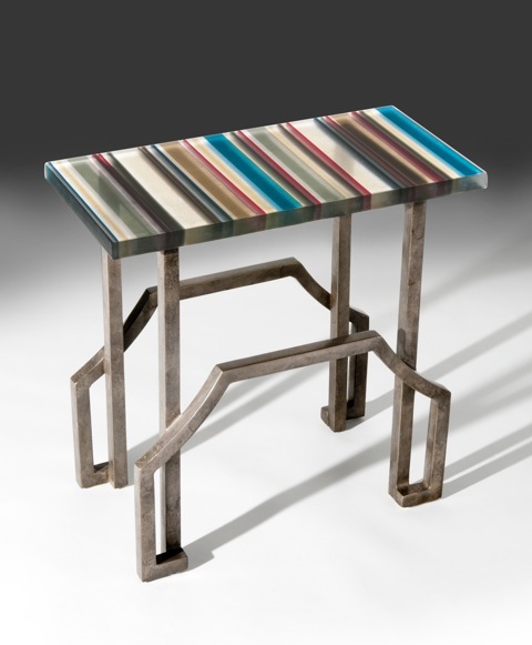 Fused glass table top on metal base with grey. red, black, brown, blue, turquoise and cream stripes by Fox Glass Works