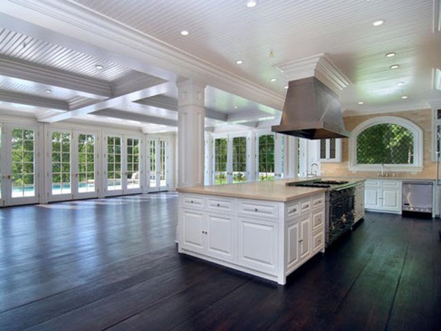 Unstaged kitchen Hamptons dark stained wood floor