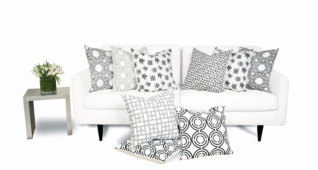 COCOCOZY Light pillows in black and white on sofa with silver side table home decor accessories textiles