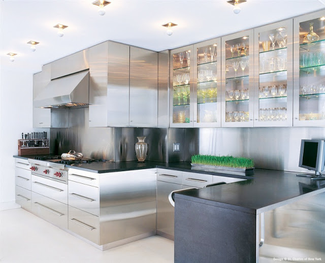kitchen with stainless steel cabinets and black counter tops