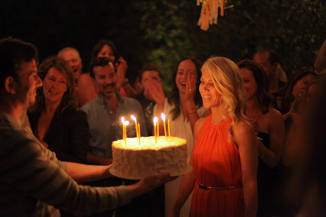 Chris Bender delivers a huge birthday cake to his wife Kristi