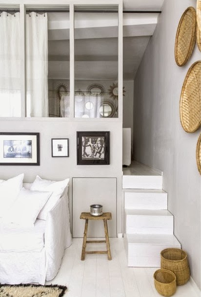 Stairs leading to the bedroom loft in a small French apartment