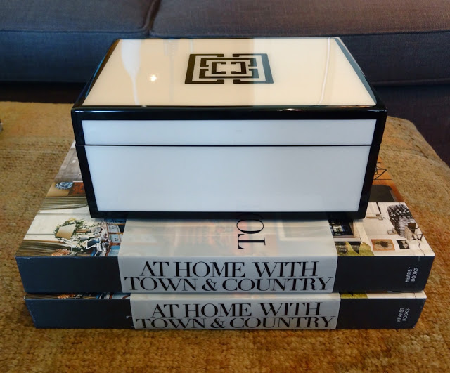 COCOCOZY Lacquer box sits on a stack of two At Home with Town and Country books
