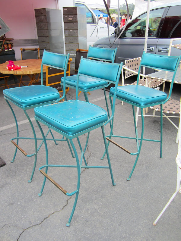 4 teal metal bar stools with vinyl seat and back covers