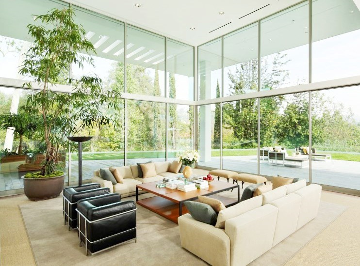 Living room in a multi million dollar Los Angeles home with floor to ceiling windows