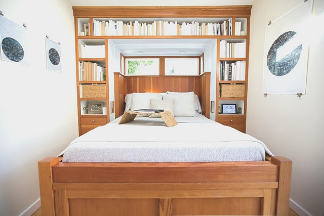 Small bedroom in a beach cottage with built in bed and book shelves