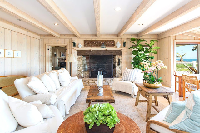 malibu estate wood paneled living room fireplace real estate listing