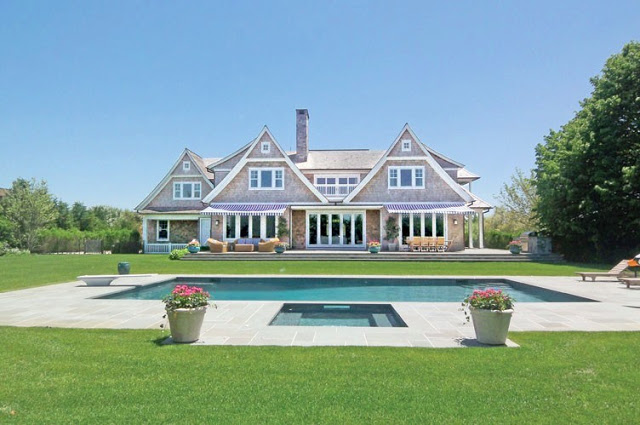 exterior photo of the backyard and pool of a house in the Hamptons